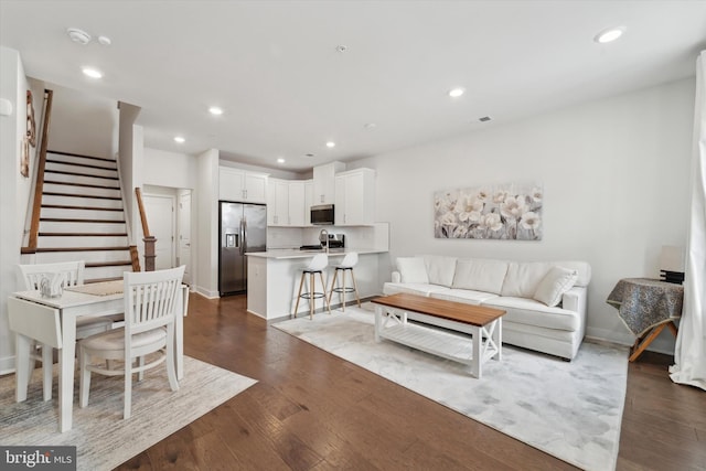 living room featuring dark hardwood / wood-style floors