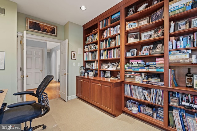 office area featuring light colored carpet