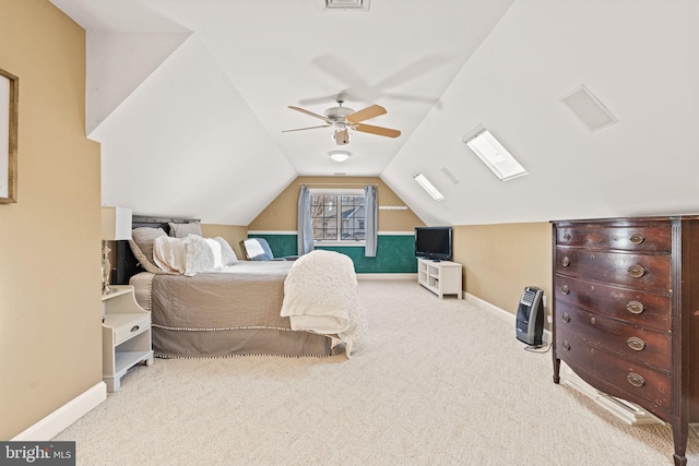 carpeted bedroom with ceiling fan and vaulted ceiling