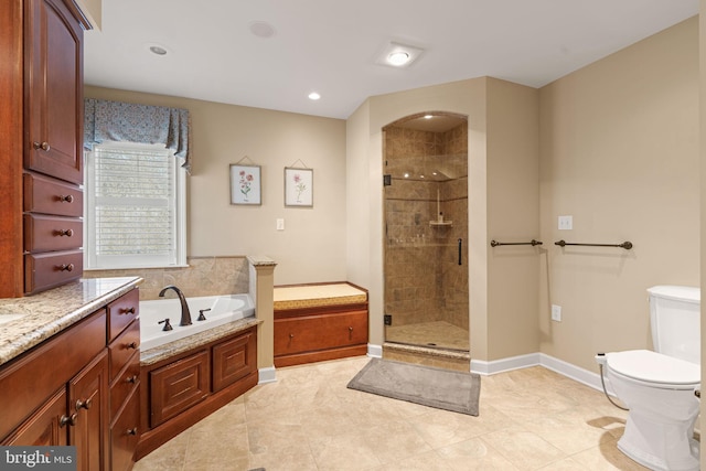 full bathroom featuring separate shower and tub, tile patterned floors, vanity, and toilet