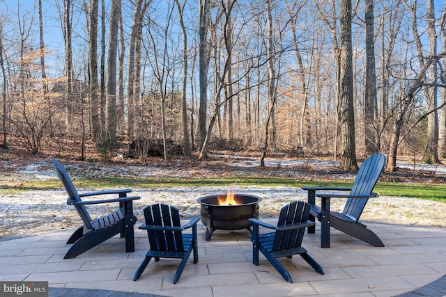 view of patio with a fire pit