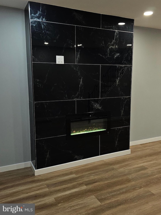 interior details with a fireplace and hardwood / wood-style floors