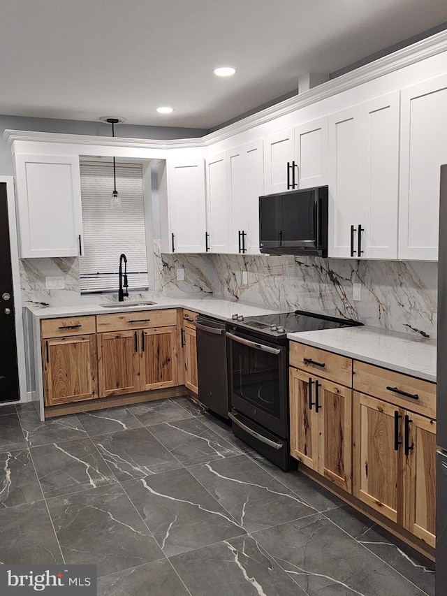 kitchen with backsplash, sink, white cabinets, and black appliances