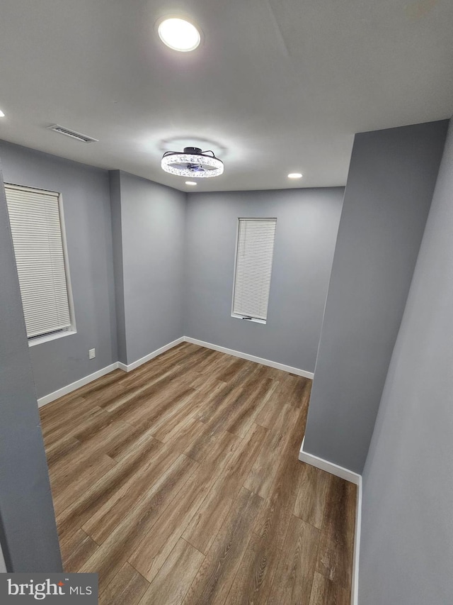 empty room with wood-type flooring