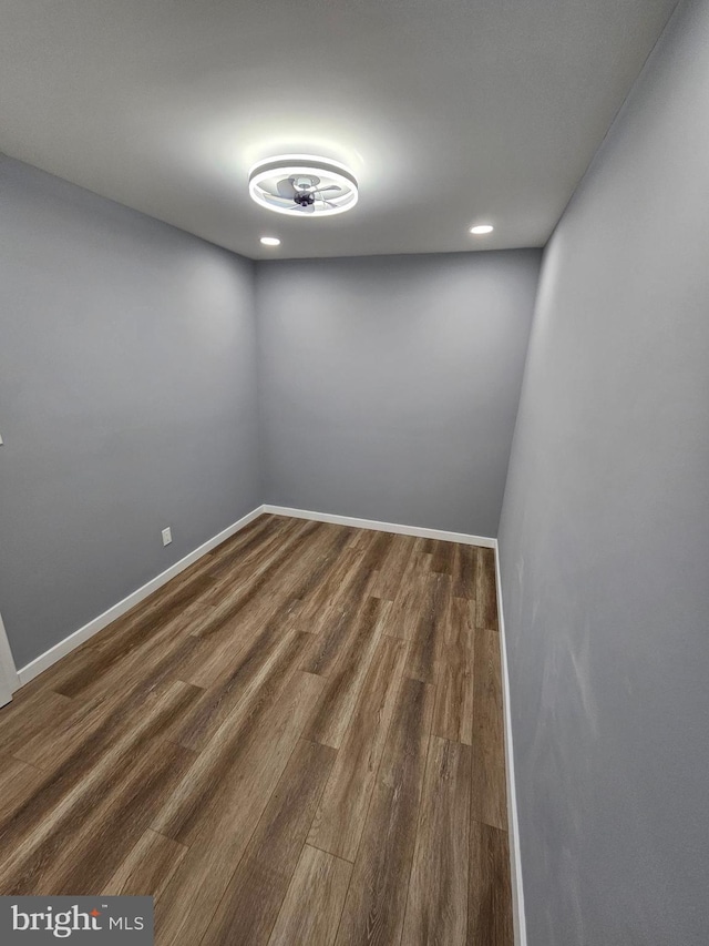 spare room with dark wood-type flooring