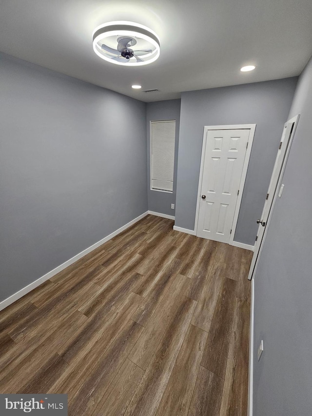 unfurnished room featuring dark hardwood / wood-style floors