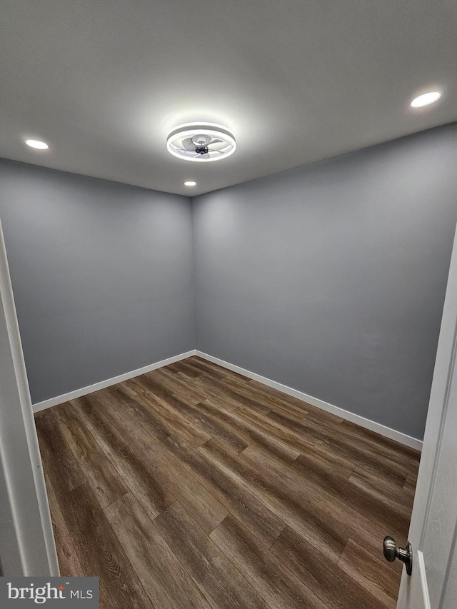 empty room featuring dark hardwood / wood-style flooring