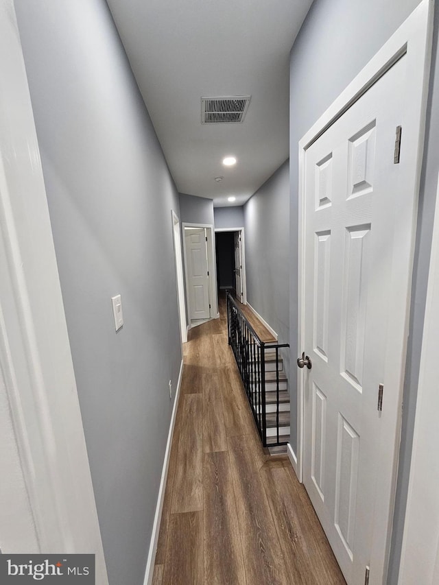 hallway with dark wood-type flooring