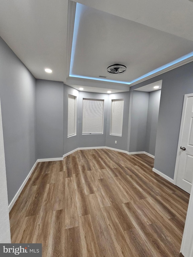 basement with hardwood / wood-style floors