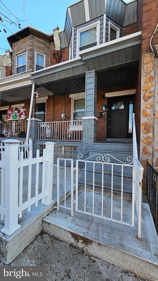 doorway to property featuring a porch