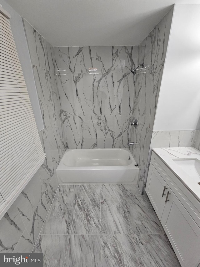 bathroom featuring vanity and shower / bathtub combination