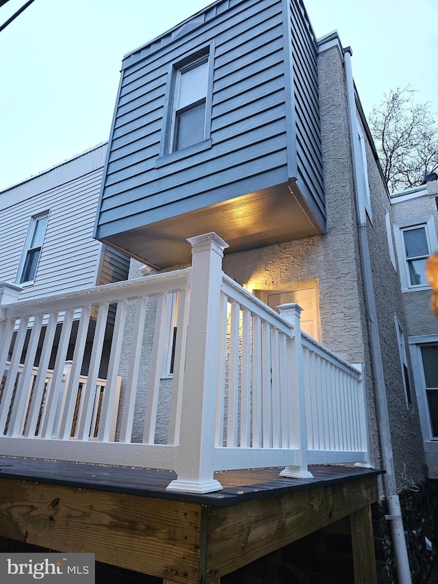 view of side of property with a balcony