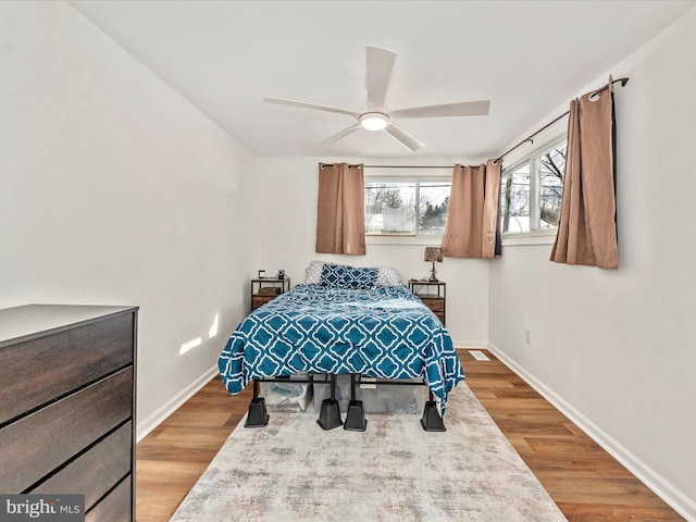 bedroom featuring hardwood / wood-style floors and ceiling fan