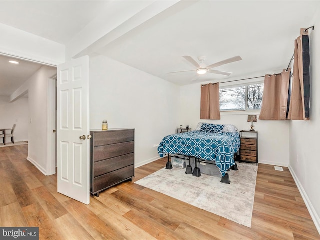 bedroom with ceiling fan and light wood-type flooring