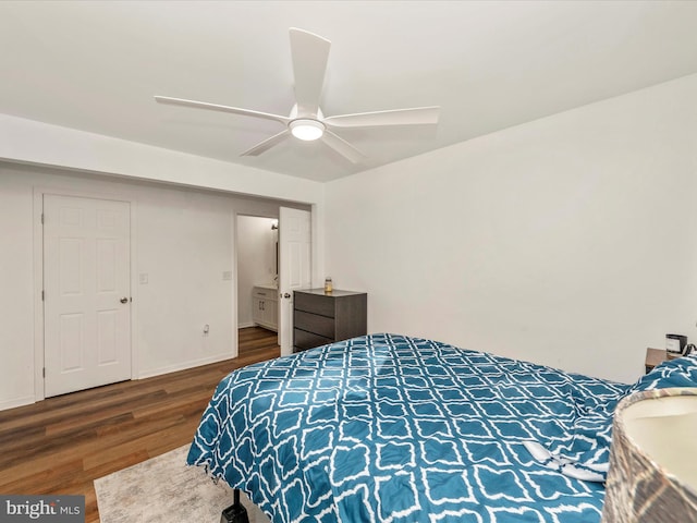 bedroom with ceiling fan and dark hardwood / wood-style flooring