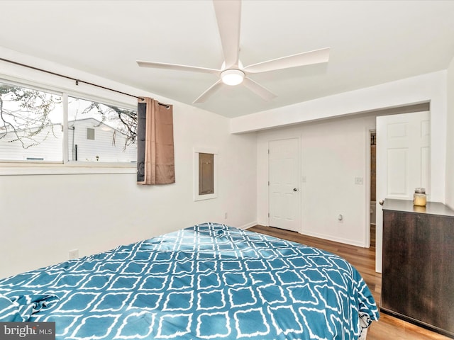 bedroom with hardwood / wood-style flooring and ceiling fan