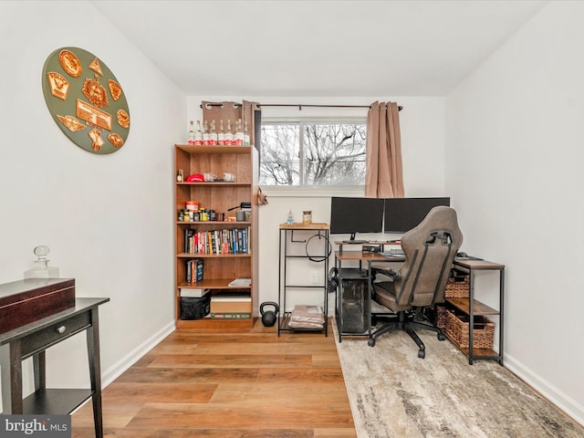 home office with hardwood / wood-style flooring