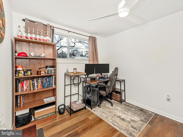 office with ceiling fan and hardwood / wood-style floors