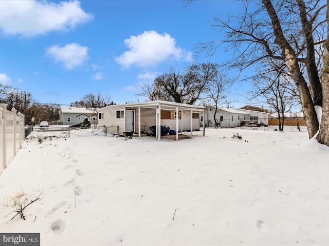 view of snow covered house