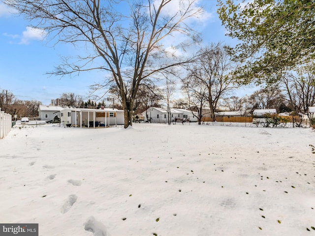 view of yard layered in snow