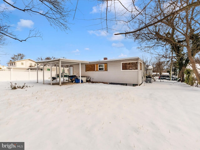 view of snow covered house