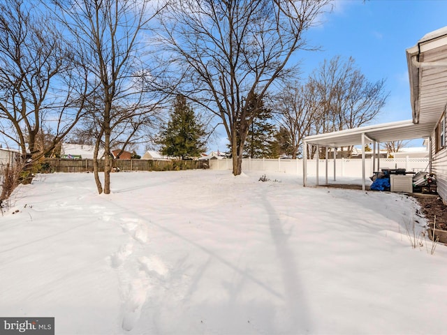 view of yard layered in snow