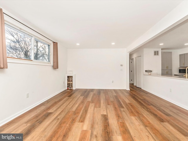 unfurnished living room featuring light hardwood / wood-style flooring