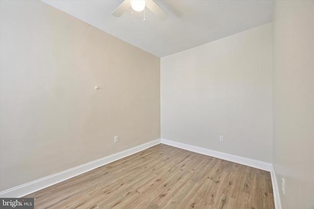 unfurnished room with ceiling fan, baseboards, and light wood-style floors
