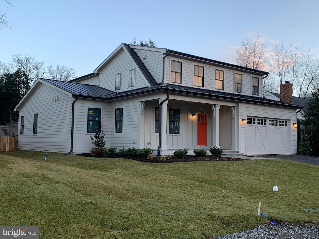 602 Martin Ave, Middleburg, VA 20117 - view of front of property with board and batten siding, driveway, a front yard, a porch, and a garage