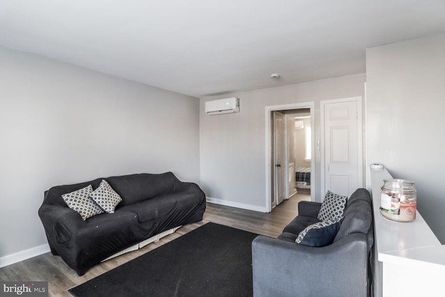 living room featuring a wall mounted air conditioner and dark hardwood / wood-style flooring