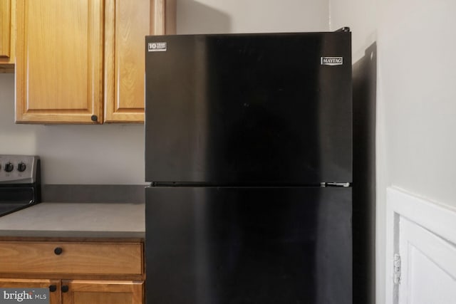 kitchen with black fridge