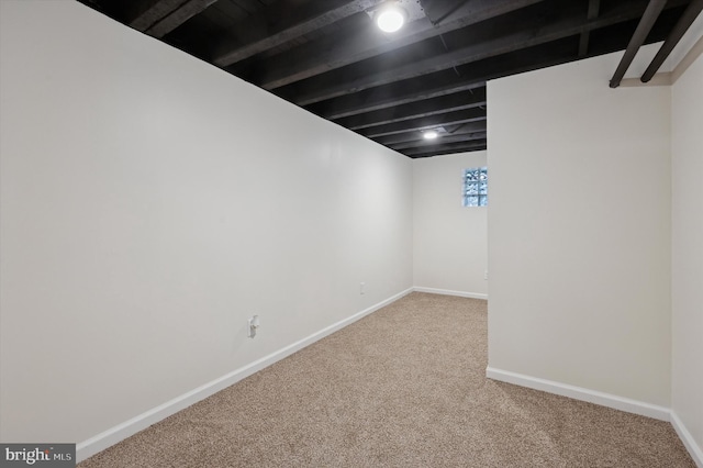 basement featuring carpet flooring