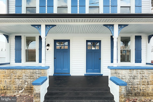 property entrance featuring covered porch