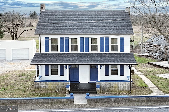 view of front of property with an outbuilding and a garage