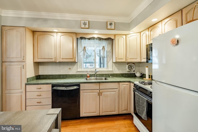 kitchen featuring sink, black appliances, and light brown cabinets