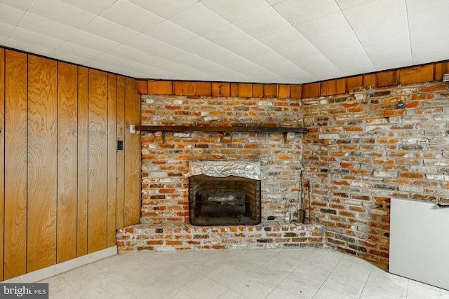 details with wood walls and a brick fireplace