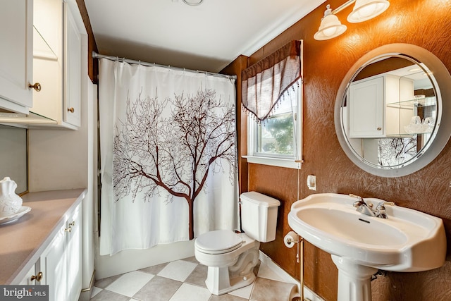 bathroom with shower / tub combo and toilet