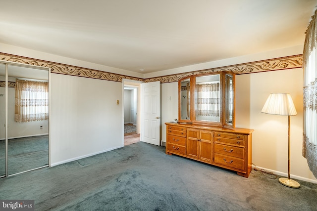 unfurnished bedroom featuring a closet and carpet