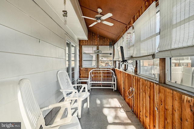 sunroom with ceiling fan and lofted ceiling