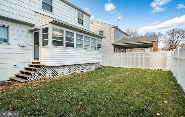 view of yard featuring a sunroom