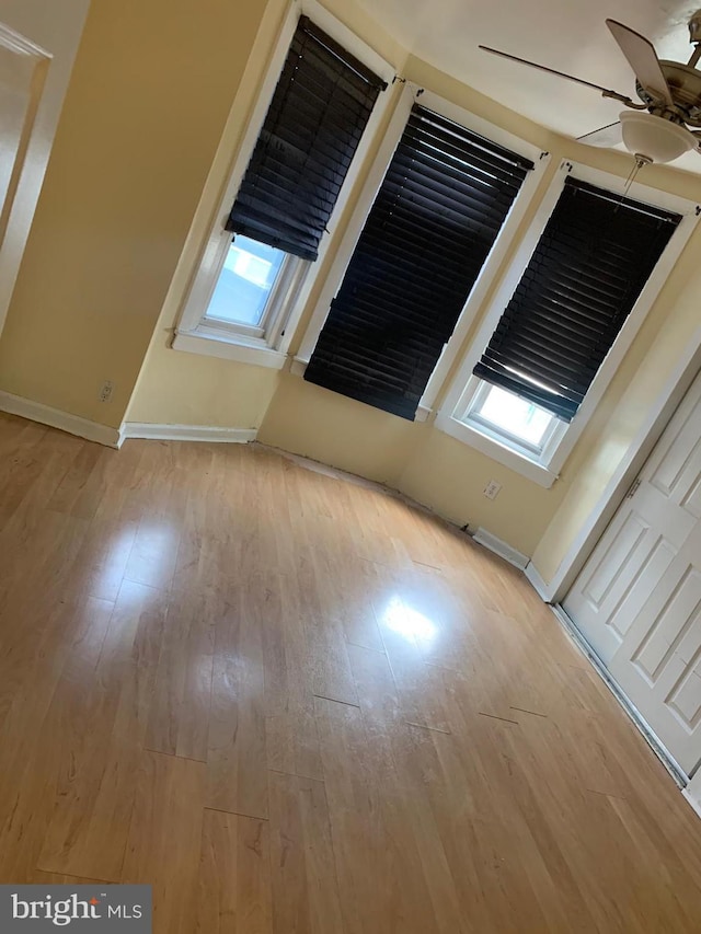 unfurnished room featuring plenty of natural light and light hardwood / wood-style flooring