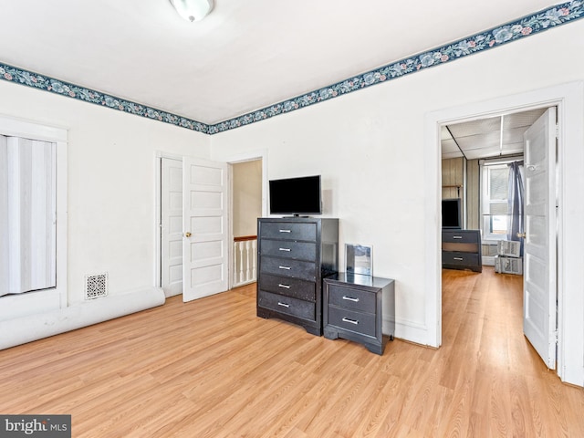 bedroom featuring light hardwood / wood-style floors