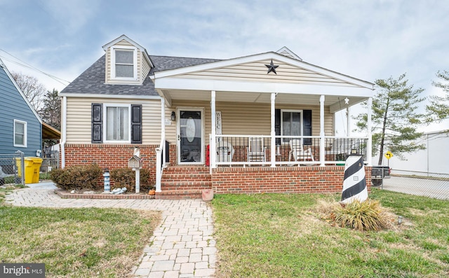 view of front of house featuring a front lawn and a porch