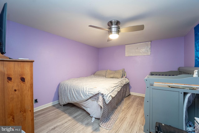 bedroom featuring light wood-type flooring and ceiling fan