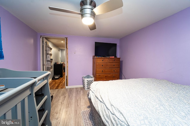 bedroom featuring ceiling fan and light hardwood / wood-style floors