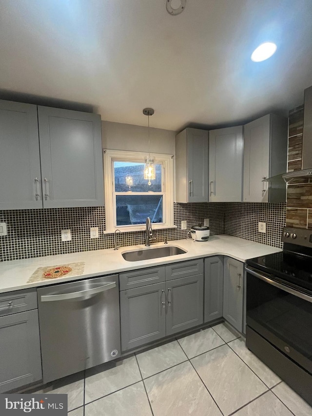 kitchen with gray cabinetry, electric range, sink, and stainless steel dishwasher