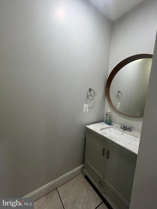 bathroom featuring tile patterned flooring and vanity