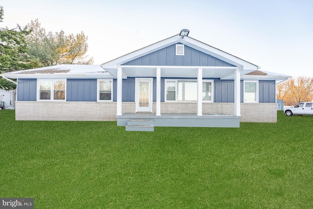 exterior space with a lawn and a porch