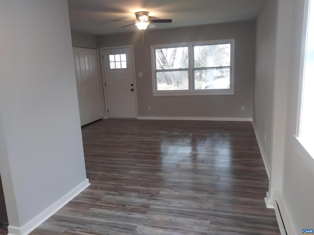 entrance foyer featuring dark hardwood / wood-style flooring and ceiling fan