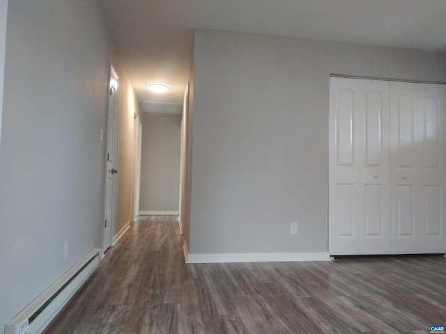 interior space featuring dark hardwood / wood-style flooring and a baseboard radiator